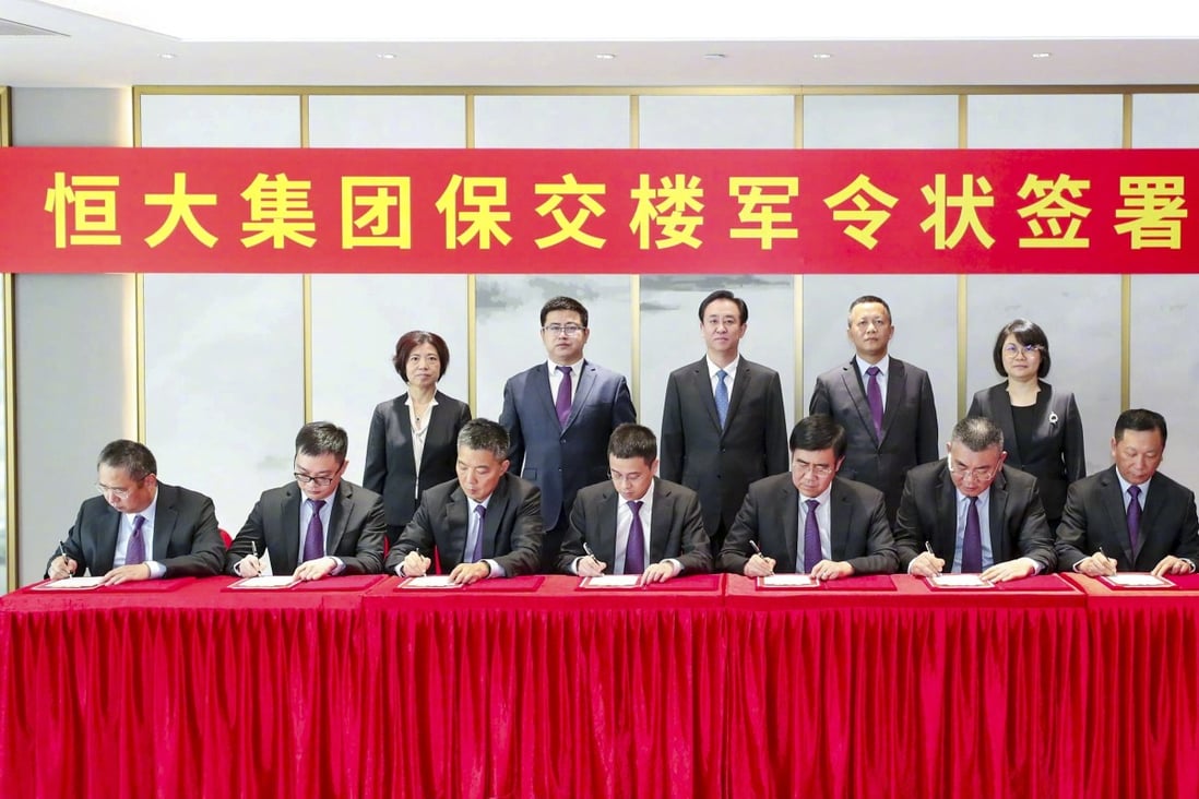 Hui Ka-yan (centre) in an undated signing ceremony with his senior executives, pledging to deliver to customers the residential property projects undertaken by the China Evergrande Group, in a photograph circulated on 1 September 2021. Photo: Weibo.