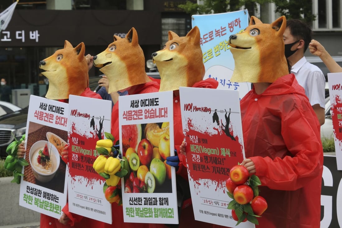 Activists wearing dog masks stage a rally in Seoul in 2020 opposing South Korea's culture of eating dog meat. Photo: AP