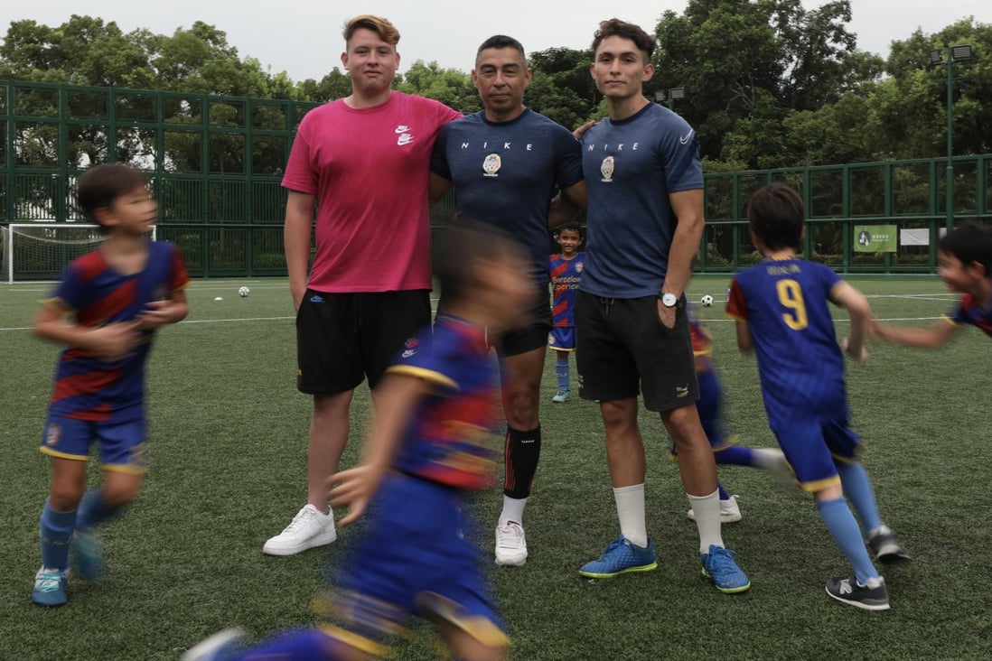 Hong Kong football coach Oscar Benavides (centre) and his two sons Oscar Jnr and Nicholas, in a training session in Man Tung Park Road pitches in Tung Chung. Photo: SCMP / Xiaomei Chen