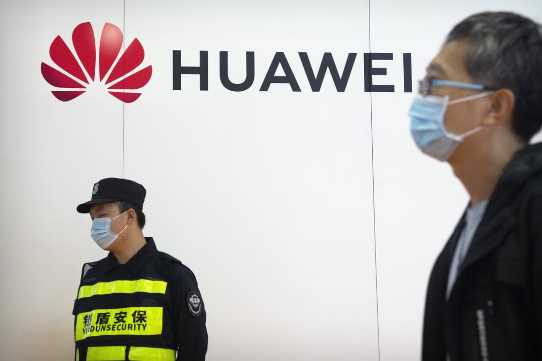 A security guard stands near Huawei Technologies Co’s booth at the PT Expo China trade show in Beijing on September 28, 2021. The telecommunications giant plans to recruit more foreign talent, as it seeks to overcome US trade sanctions. Photo: AP