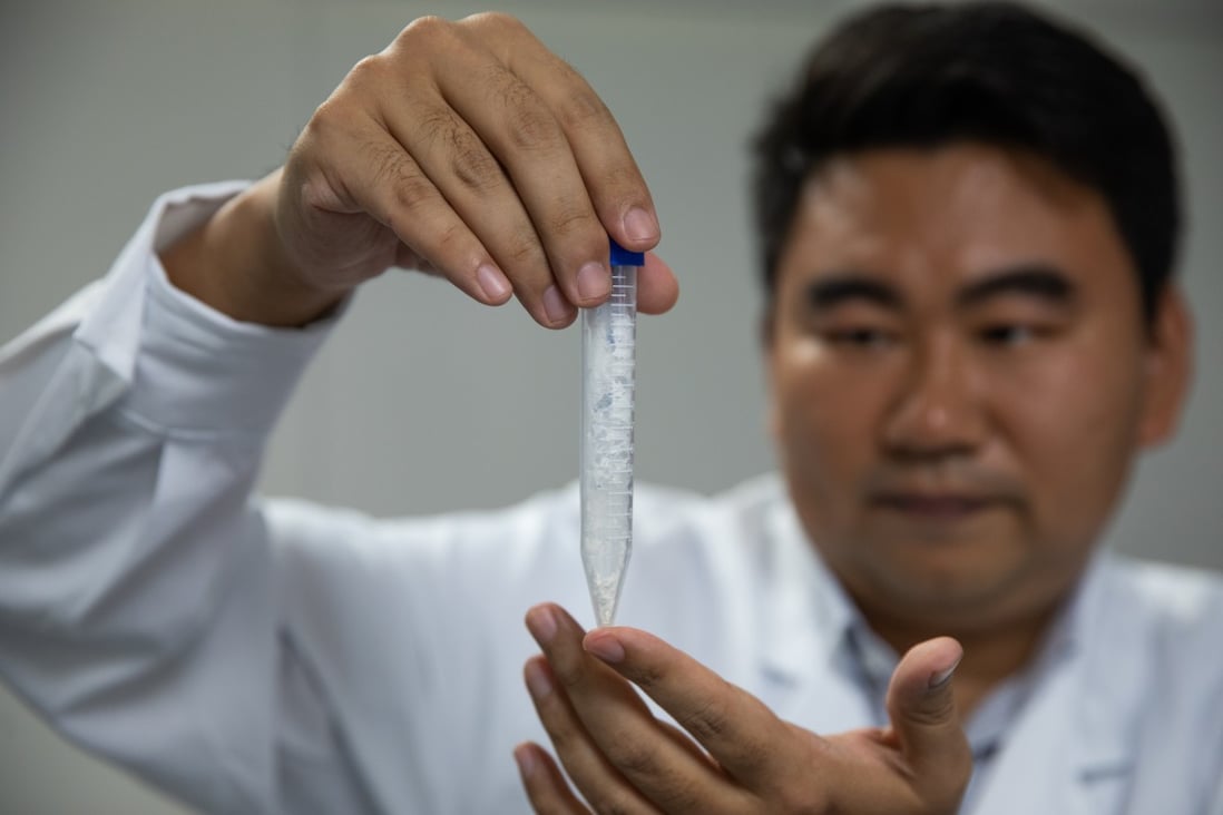 Scientist Cai Tao shows a sample of synthesised starch at a lab earlier this month. Photo: Xinhua
