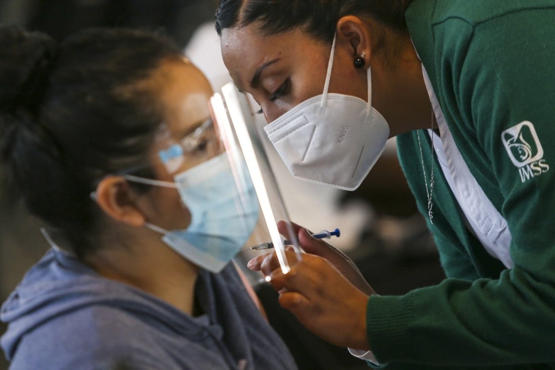 A health worker delivers CanSino Covid-19 vaccine during a mass vaccination for teachers and school staff in Mexico City in May. China’s Covid-19 Vaccines Overseas Evaluation Programme will be held in countries where Chinese vaccines are used. Photo: Reuters