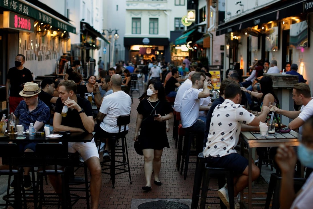 People dine at Boat Quay in Singapore. Photo: Reuters