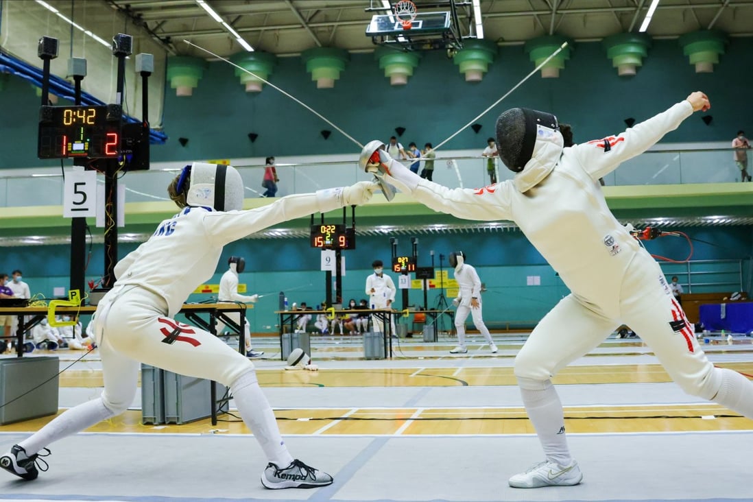 Coco Lin Yik-hei (left) takes on Debbie Ho Tik-lam (right) at the LCSD Fencing Championships quarter-finals at Hong Kong Park Sports Centre. Photo: Nora Tam