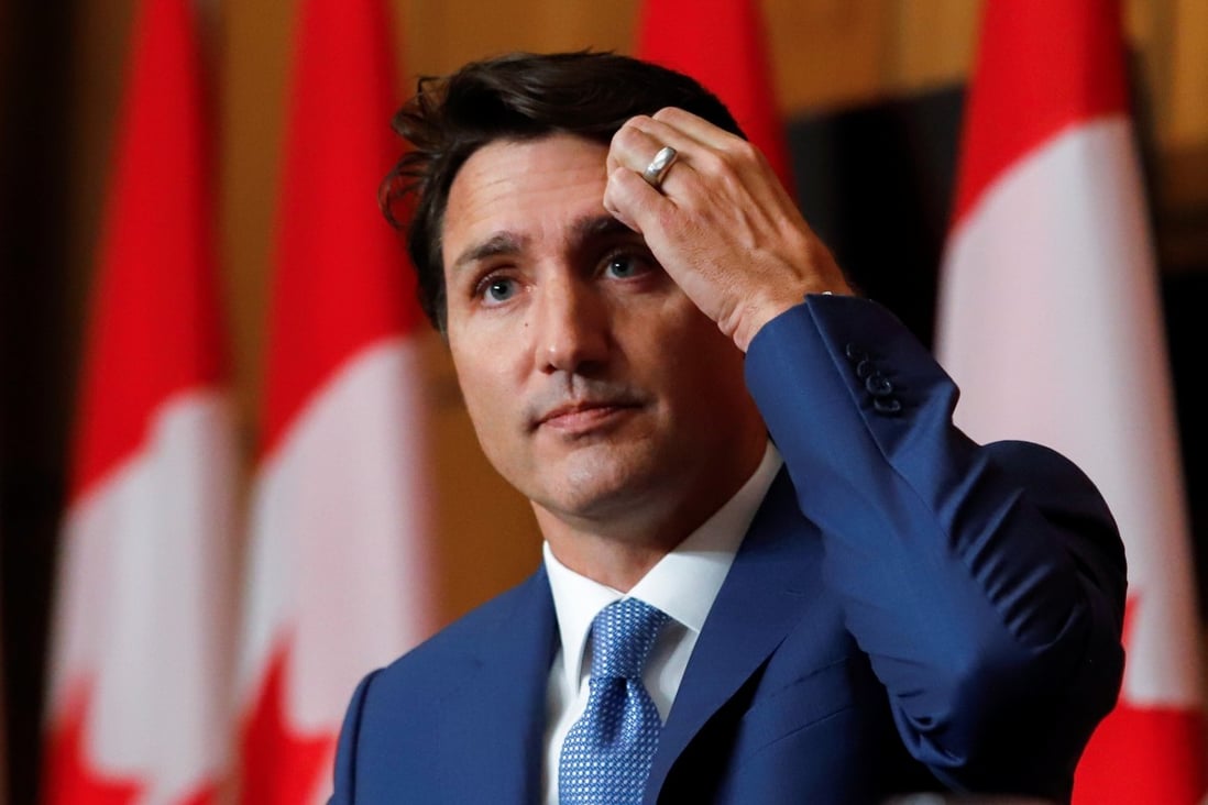 Canada’s Justin Trudeau ‘regrets’ beach holiday on day to honour