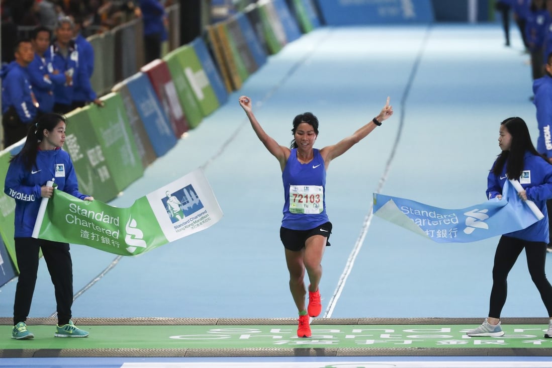 Christy Yiu wins the women's half marathon at the 2019 showpiece. She will lead a strong local contingent for the delayed 2021 Standard Chartered Hong Kong Marathon in this month. Photo: Nora Tam