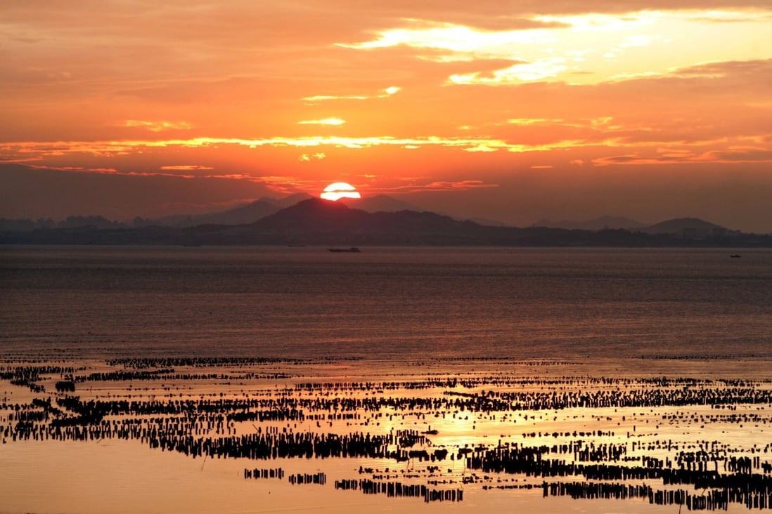The sun sets over China’s southeastern coast of Fujian as seen from Taiwan’s frontline island of Quemoy, also called Kinmen. Photo: Reuters