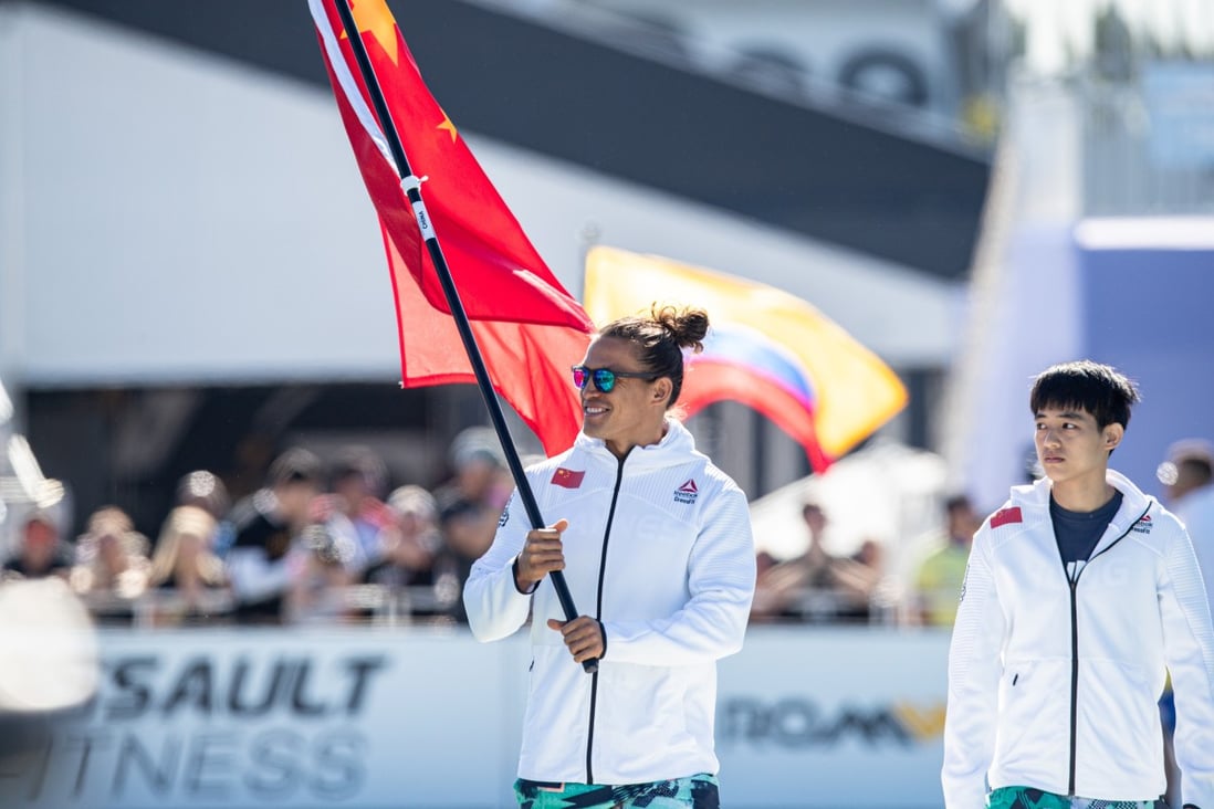 Hong Kong’s Ant Haynes carrying the Chinese flag and Taiwan’s Ruei Hung Tsai-jui during the opening ceremony of the 2019 CrossFit Games. Photo: CrossFit Games