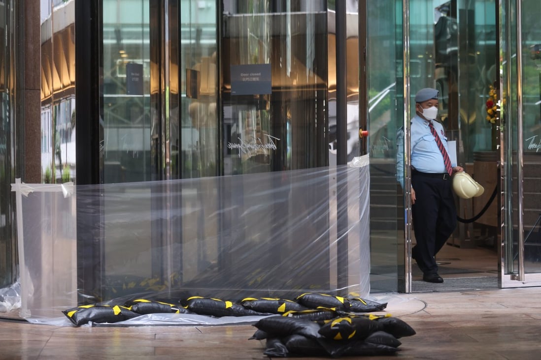 Plastic sheeting is wrapped across the entrance of the closed Exchange Square building, which houses the stock market, in Central on Wednesday. Photo: Nora Tam