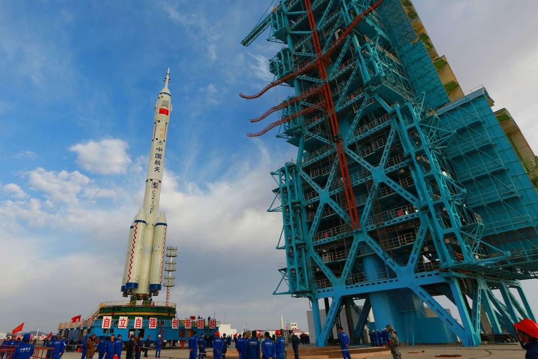 A Long March 2F carrier rocket, carrying the Shenzhou 13 spacecraft, at the Jiuquan satellite launch centre in China. Photo: AFP