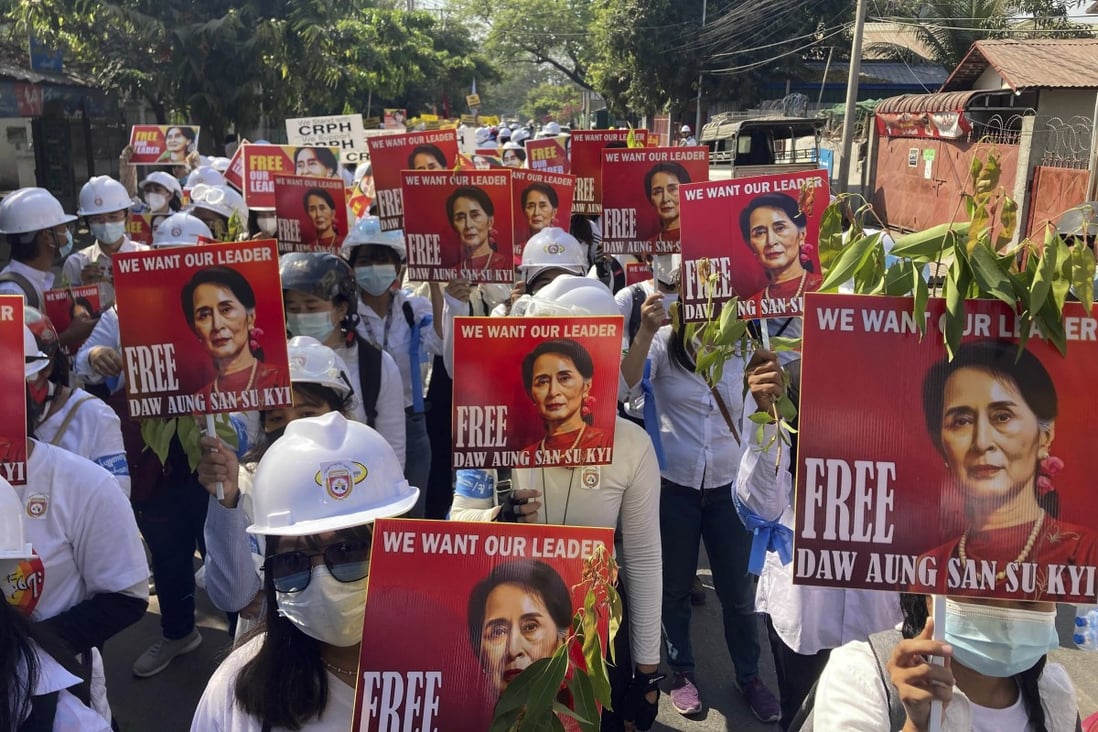 Protesters hold portraits of deposed Myanmar leader Aung San Suu Kyi at an anti-coup demonstration in Mandalay. File photo: AP