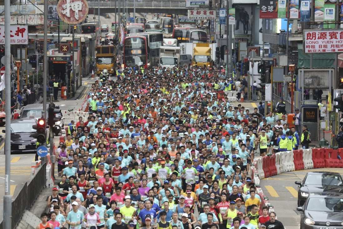 The 2021 Standard Chartered Hong Kong Marathon will be the first mass participatory sports events since coronavirus hit Hong Kong last year. Runners are pictured at the start in Tsim Sha Tsui’s Nathan Road ahead of the 2019 event. Photo: Dickson Lee