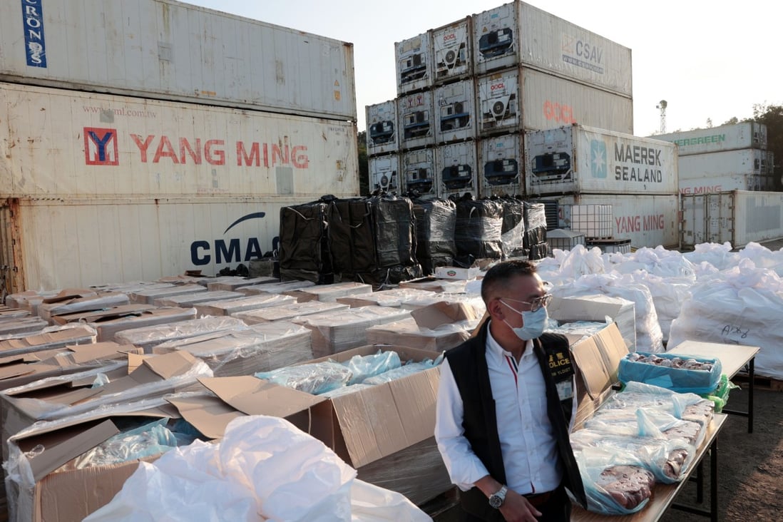 A police officer stands among the boxes of meat seized in Lok Ma Chau near Hong Kong’s border with mainland China on Tuesday. Photo: Sam Tsang