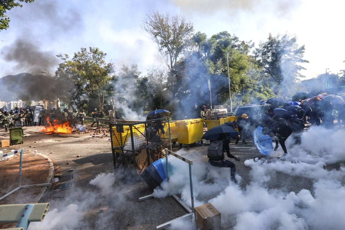 Riot police fire tear gas to disperse protesters outside Chinese University on November 11, 2019. Photo: Felix Wong