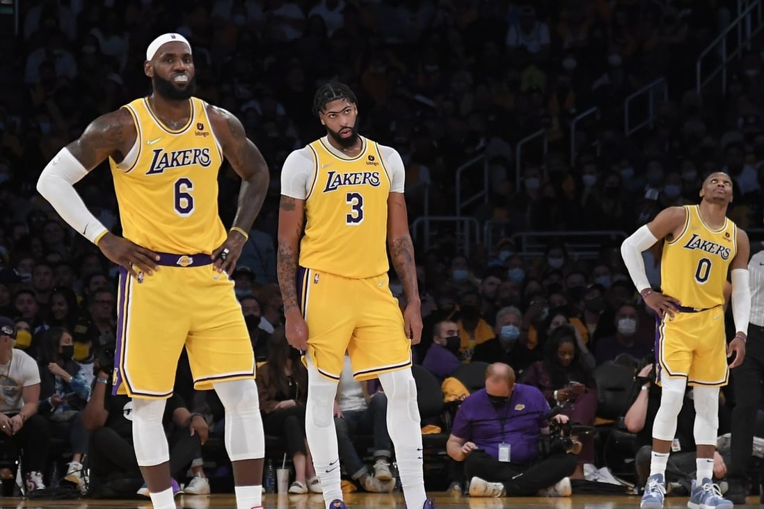 LeBron James (left), Anthony Davis (centre), and Russell Westbrook of the Los Angeles Lakers react during the second half of their 2021-22 NBA season opener against Golden State Warriors. Photo: AFP