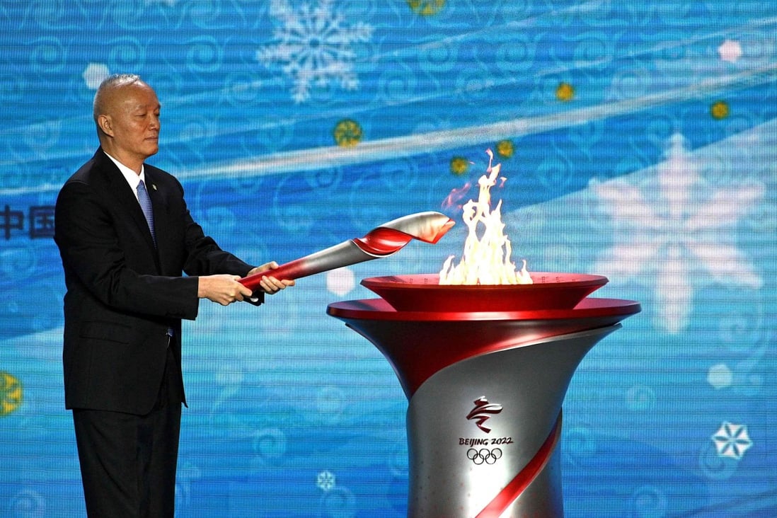 Cai Qi, the Communist Party secretary of Beijing, lights the Olympic cauldron in Beijing after the flame’s arrival on Wednesday. Photo: AFP