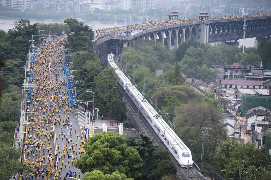 Participants run along the Wuhan Yangtze River Bridge at the 2019 Wuhan Marathon. The event has not taken place since. Photo: Xinhua