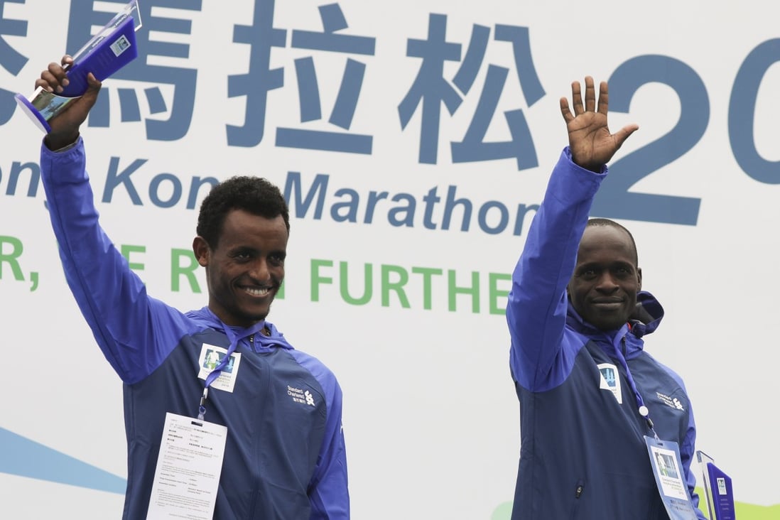 Winner Barnabus Kiptum of Kenya (right) and second-place Dawit Wolde of Ethiopia on the podium after breaking the Hong Kong Marathon men’s course record at Victoria Park in 2019. Photo: Edmond So
