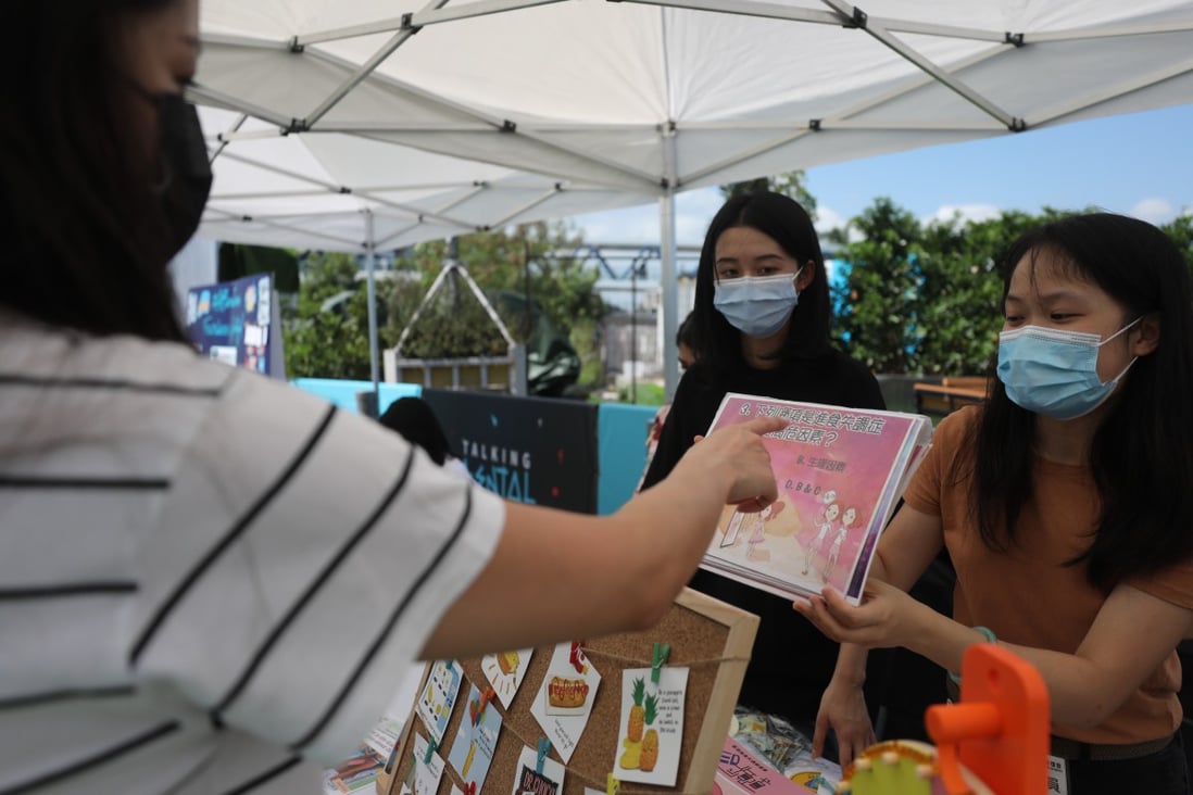 A member of the public (left) plays a quiz to raise awareness about eating disorders and other mental health issues at the Talking Mental Hub in Central. Photo: SCMP/Xiaomei Chen