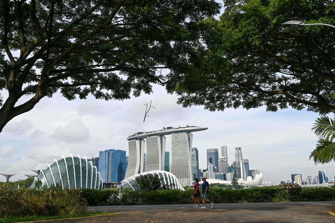 People walk through Marina Bay East Park near the financial business district in Singapore. Photo: AFP