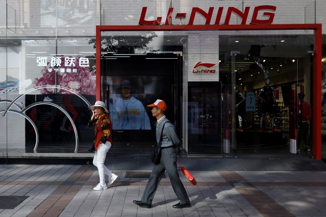 People walk past a Li-Ning store in Beijing. Photo: AFP