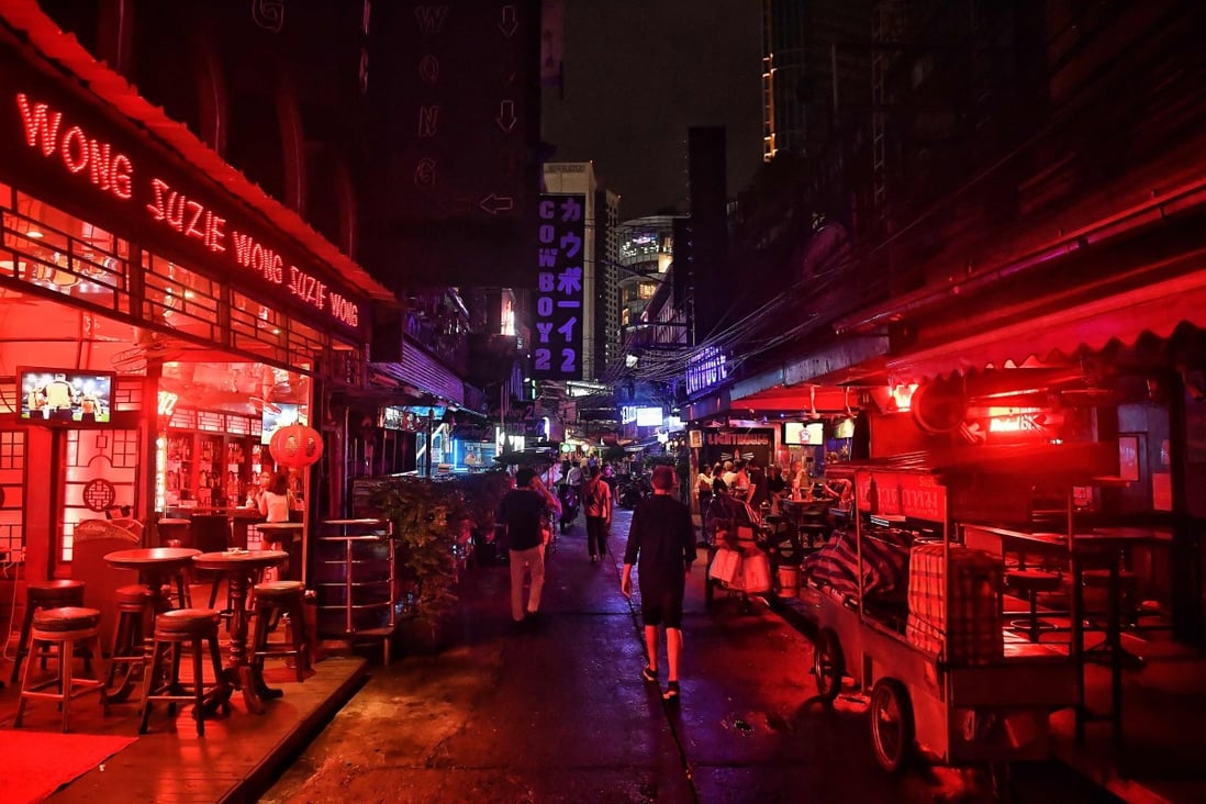 Bangkok’s Soi Cowboy area after bars were allowed to open with tight restrictions on alcohol sales. Industry players fear many of the independent bars and clubs that give the city its character will close. Photo: AFP