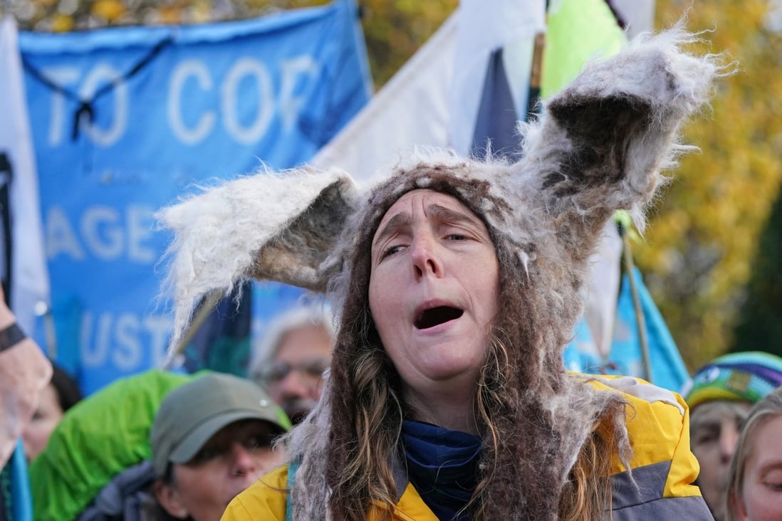 A woman takes part in a protest on Saturday to ask delegates to make bottom trawling/dredging a thing of the past, ahead of the COP26 climate conference in Glasgow, Scotland Photo: PA / DPA