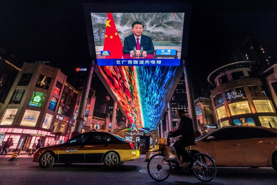 President Xi Jinping’s address to world leaders at the G20 summit on Sunday is shown on a screen at a Beijing shopping centre. The meeting was a prelude to COP26 in Glasgow. Photo: Reuters