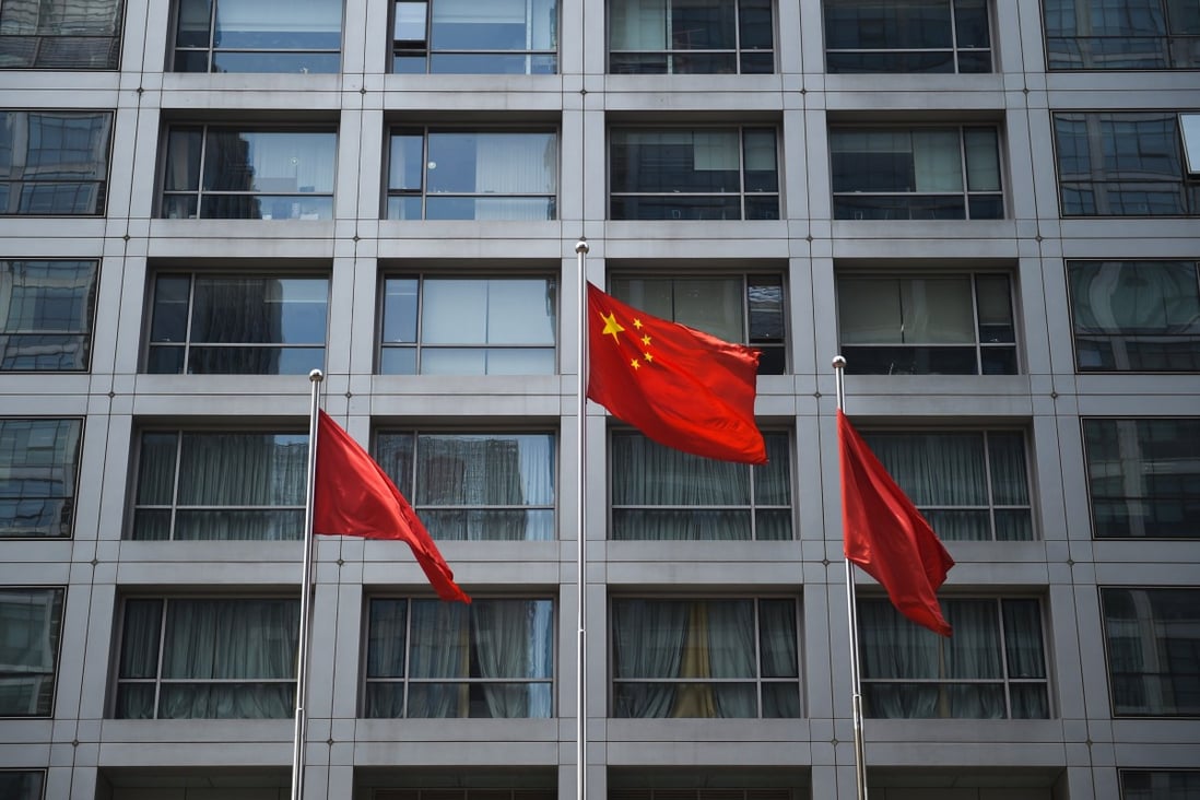 The Chinese flag outside the offices of the China Securities Regulatory Commission in Beijing. Photo: Getty Images