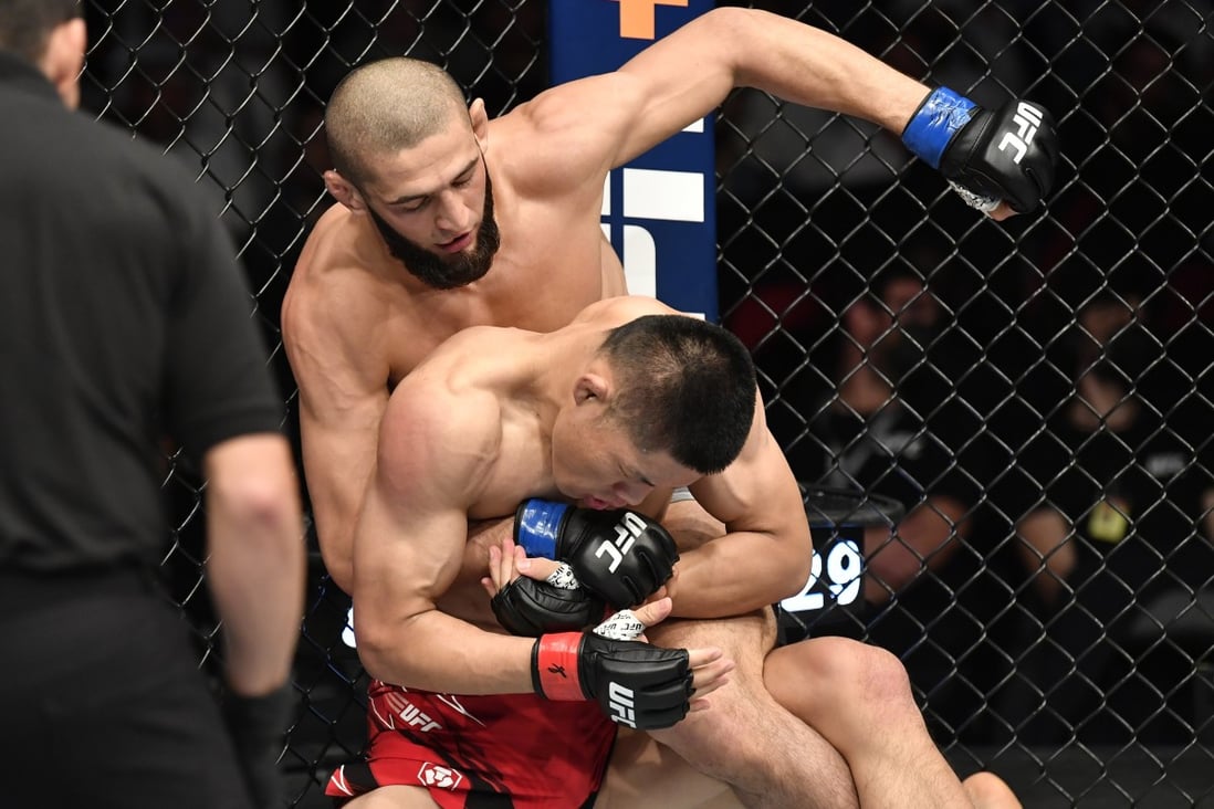 Khamzat Chimaev punches Li Jingliang in their welterweight fight at UFC 267. Photo:= Chris Unger/Zuffa LLC