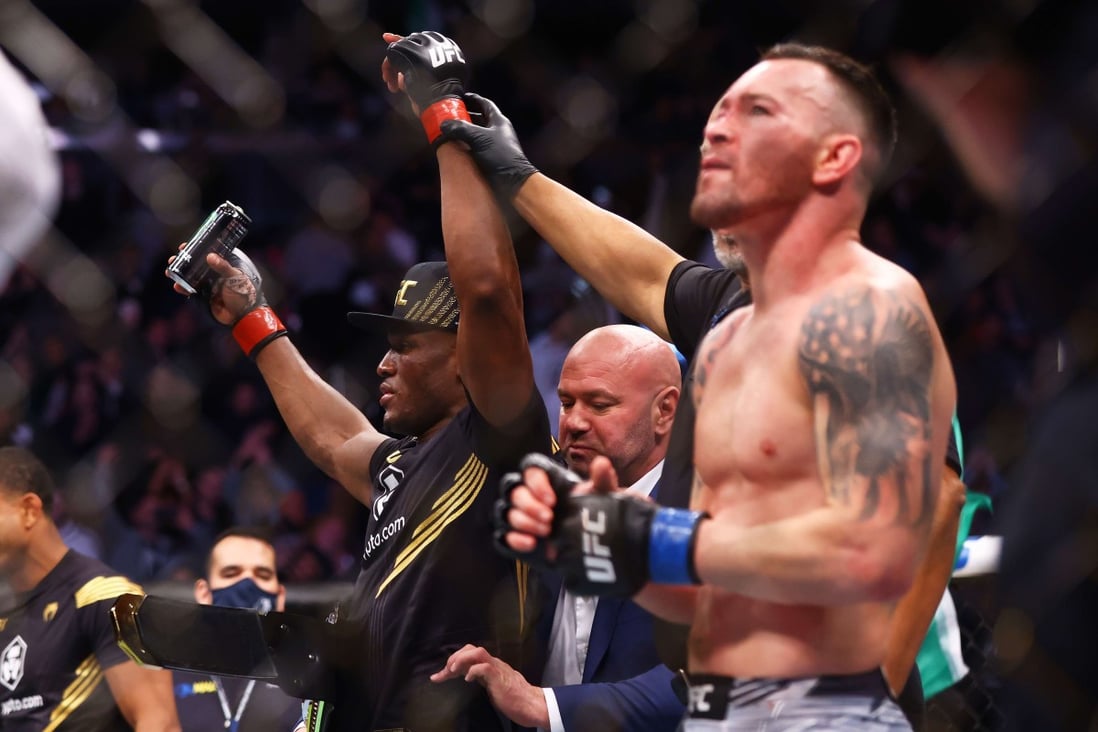 Kamaru Usman celebrates after his decision victory over Colby Covington in their welterweight title bout at UFC 268. Photo: AFP