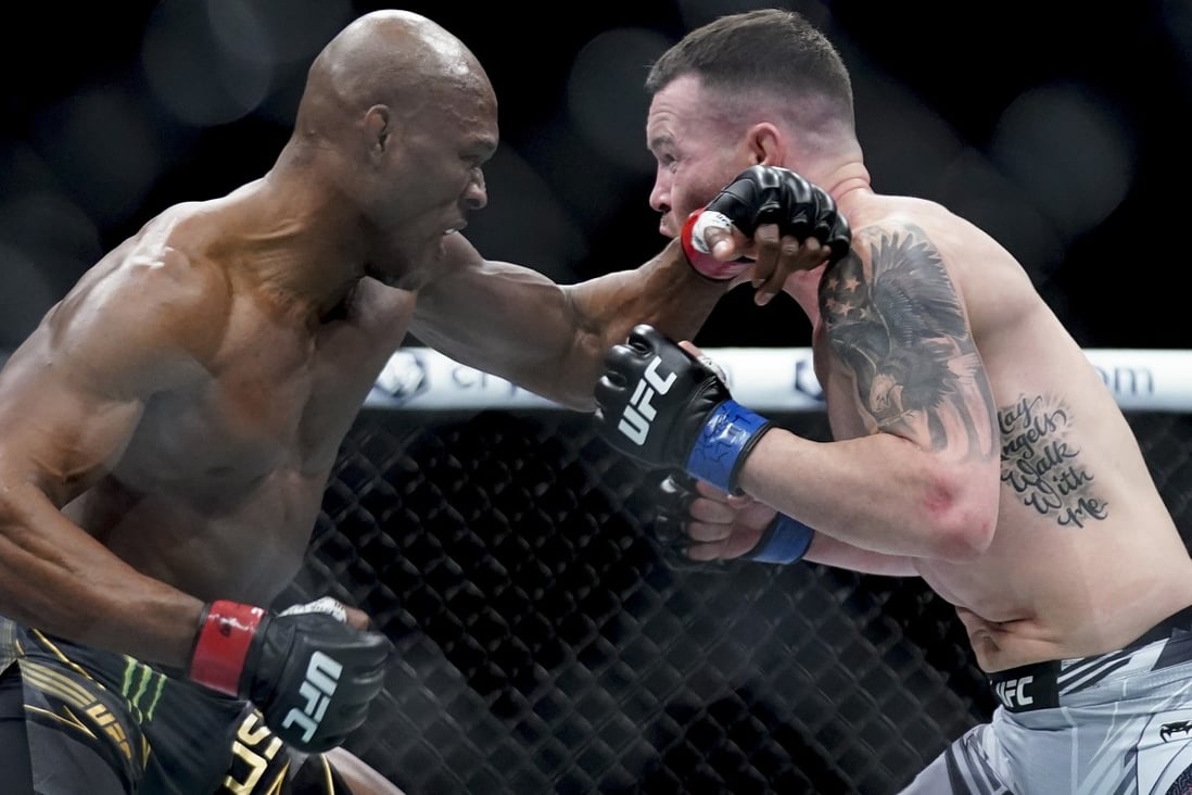 Kamaru Usman (left) exchanges punches with Colby Covington during their welterweight title fight at UFC 268. Photo: AP