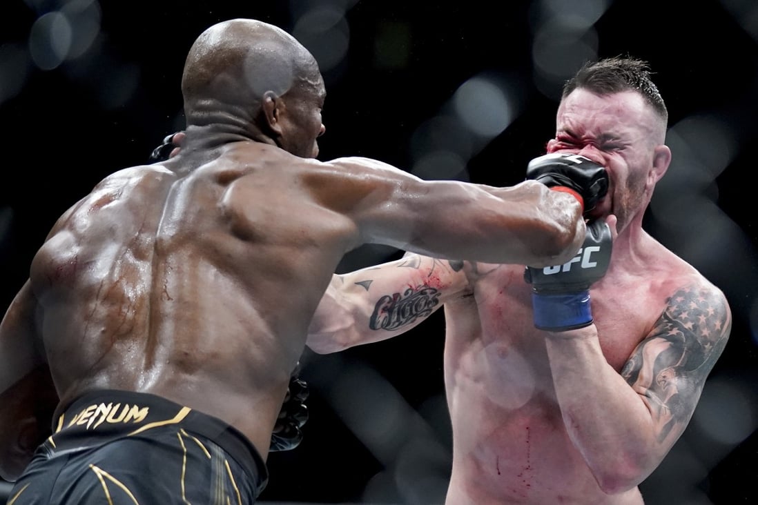 Kamaru Usman lands a punch on Colby Covington’s face during the welterweight title main event at UFC 268. Photo: AP