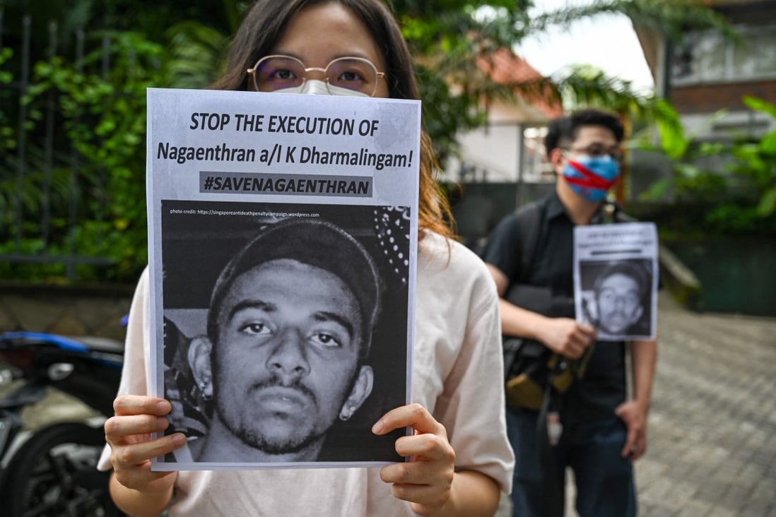 Activists hold placards to urge Singapore to stop the execution of Nagaenthran K. Dharmalingam on November 3, 2021. Photo: AFP