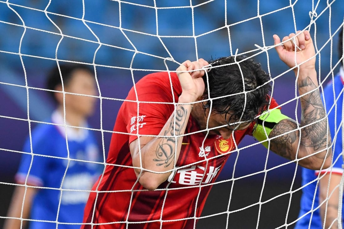 Chinese international footballer Ricardo Goulart, also known as Gao Late in China, grabs the goal net in dismay while playing for Hebei FC in the 2020 Chinese Super League. Photo: Xinhua