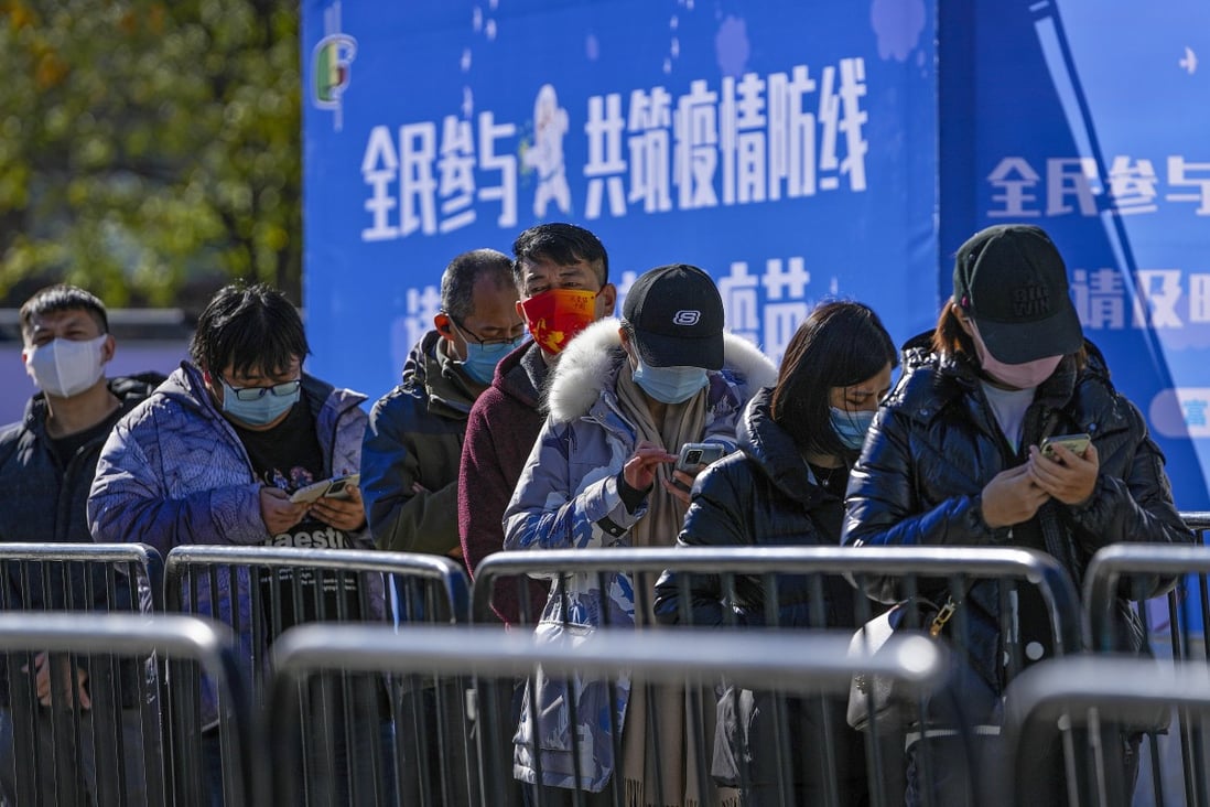 Beijing residents line up to receive booster shots against Covid-19 at a vaccination site on Wednesday. Photo: AP