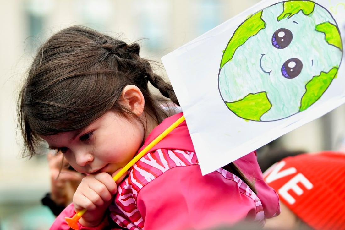 A child at the Fridays for Future march during the UN Climate Change Conference (COP26), in Glasgow, Scotland. Photo: Reuters