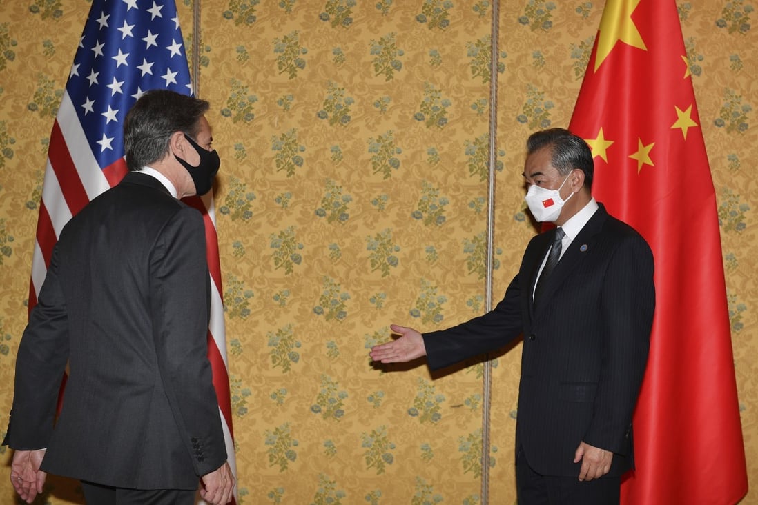 Chinese Foreign Minister Wang Yi (right) says China and the US should meet each other halfway. Photo: AP