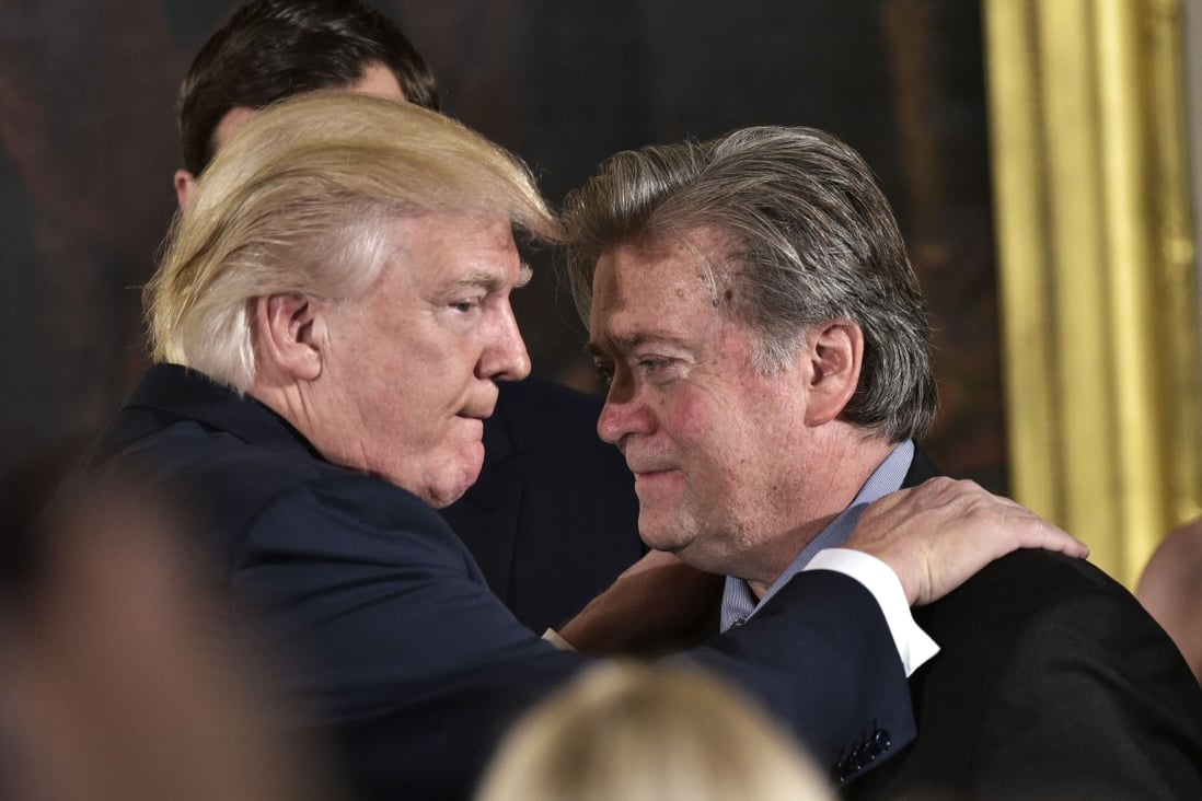 Then US President Donald Trump (left) congratulates Steve Bannon during the swearing-in of senior staff at the White House in January 2017. Photo: AFP