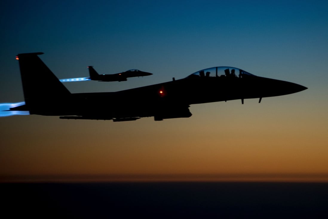 A pair of US Air Force F-15E Strike Eagles fly over northern Iraq in September 2014 after conducting air strikes in Syria. Photo: US Air Forces Central Command via AFP