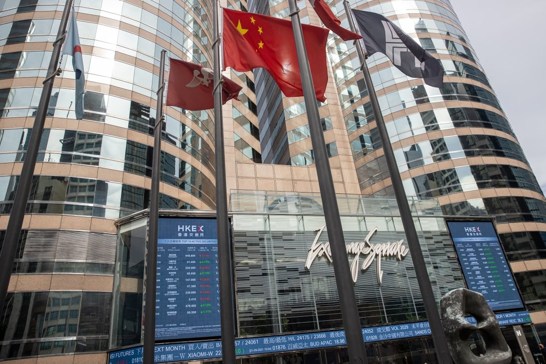 Electronic billboards display stock transactions on Exchange Square, the location of the Hong Kong stock exchange, on September 21. Photo: EPA-EFE