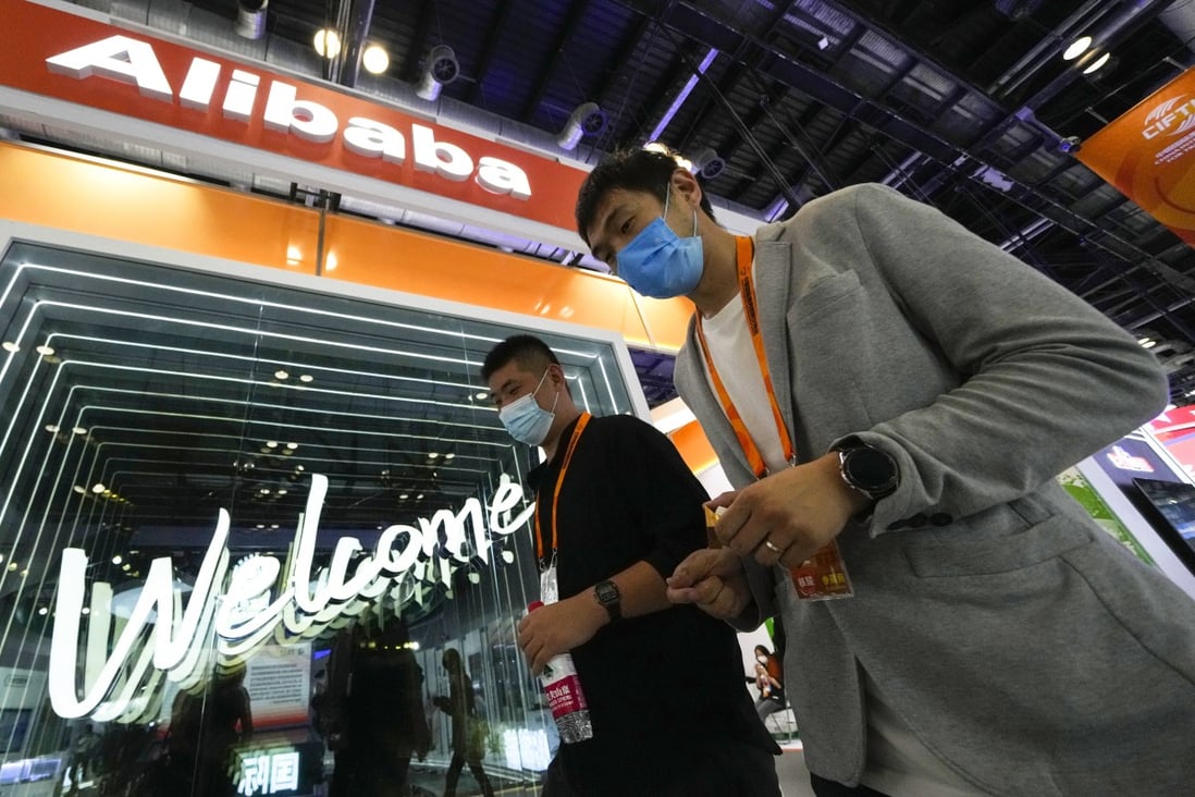 Visitors pass by the Alibaba booth during the China International Fair for Trade in Services in Beijing in September 2021. Photo AP