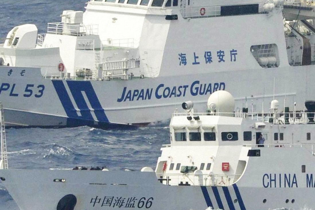 A Chinese marine surveillance vessel and a Japan coastguard patrol ship near the Diaoyu Islands in the East China Sea. File photo: Kyodo via Getty Images