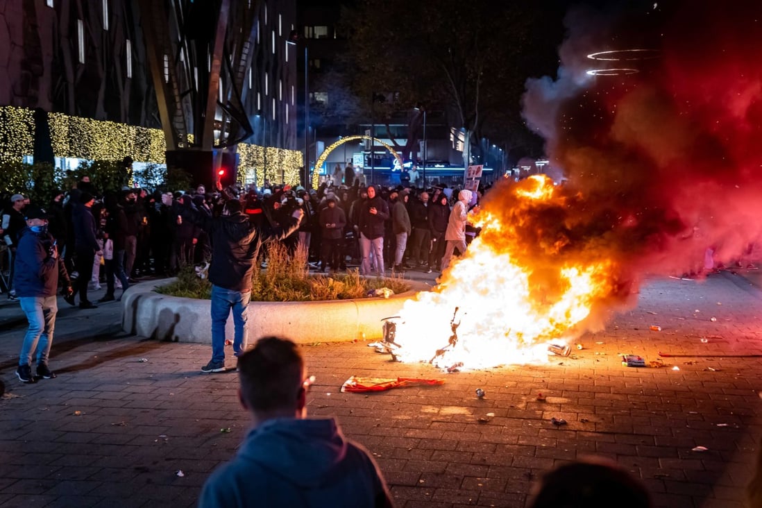 A scooter was set on fire during a protest in Rotterdam, the Netherlands on Friday. Photo: EPA-EFE