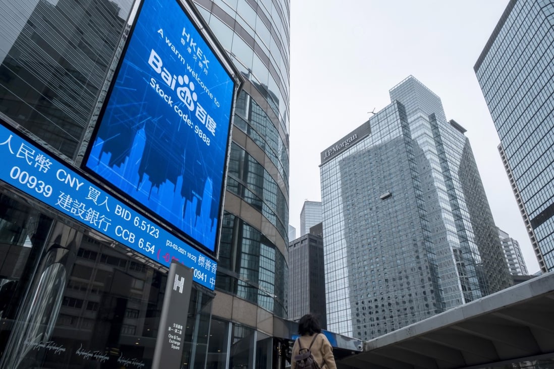 An electronic board showing stock and index levels outside the Exchange Square complex in Hong Kong. Photo: Bloomberg