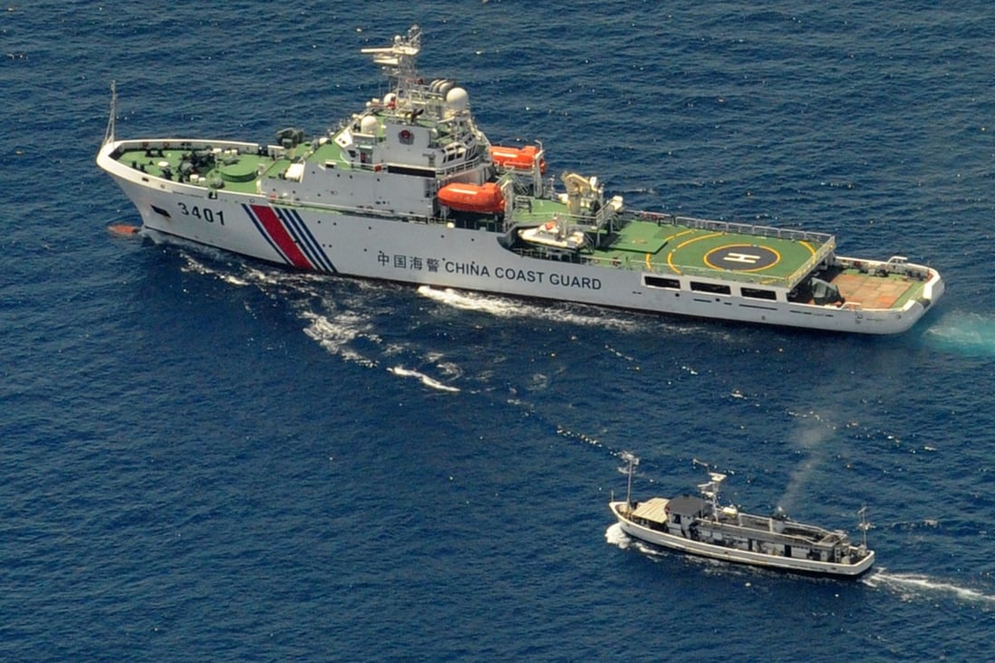 A Chinese coast guard ship and a Philippine supply boat during a 2014 stand off near the Second Thomas Shoal in the South China Sea. Photo: AFP