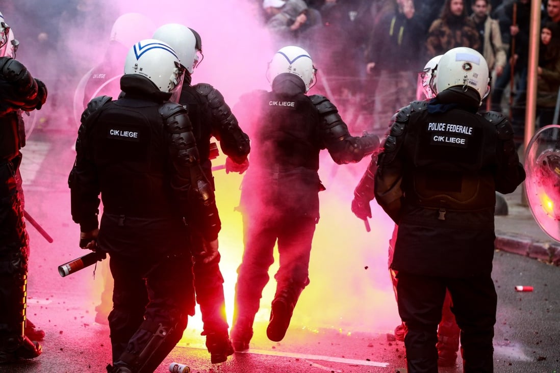 Riot police clash with protesters in Brussels, Belgium. Photo: EPA-EFE