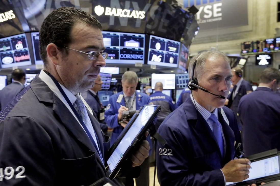 Traders on the floor of the New York Stock Exchange as earnings season kicks off. Photo: AP