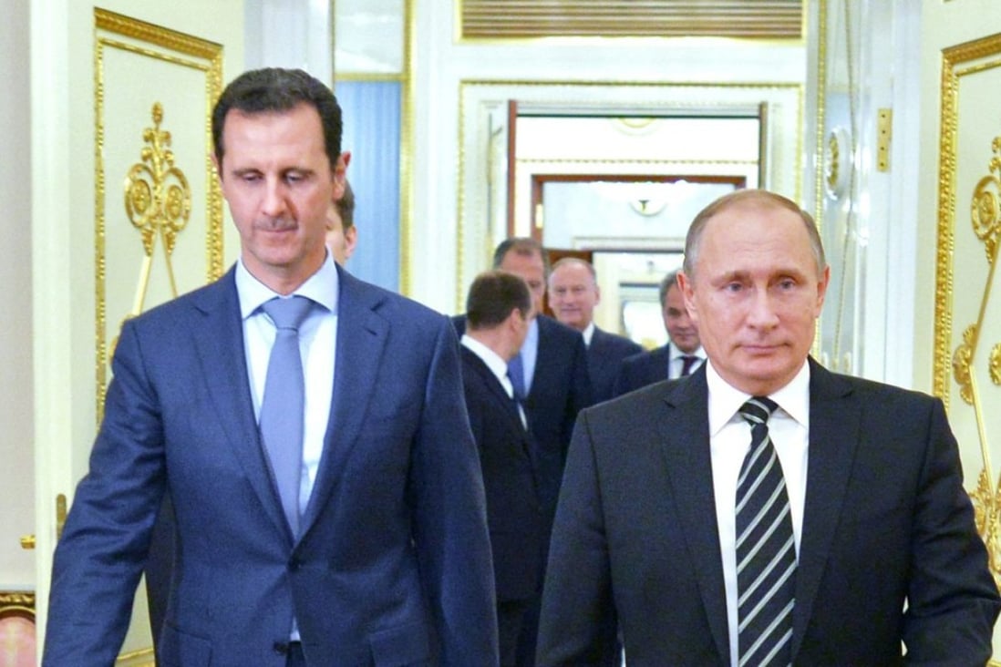 Russian President Vladimir Putin (R) and Syrian President Bashar al-Assad attend a meeting at the Kremlin in Moscow, Russia. The multi-party talks will be held in Vienna. Photo: EPA