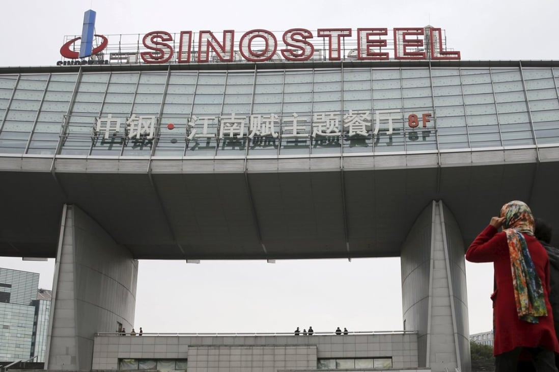 Workers walk past Sinosteel's headquarters in Beijing. Photo: Reuters